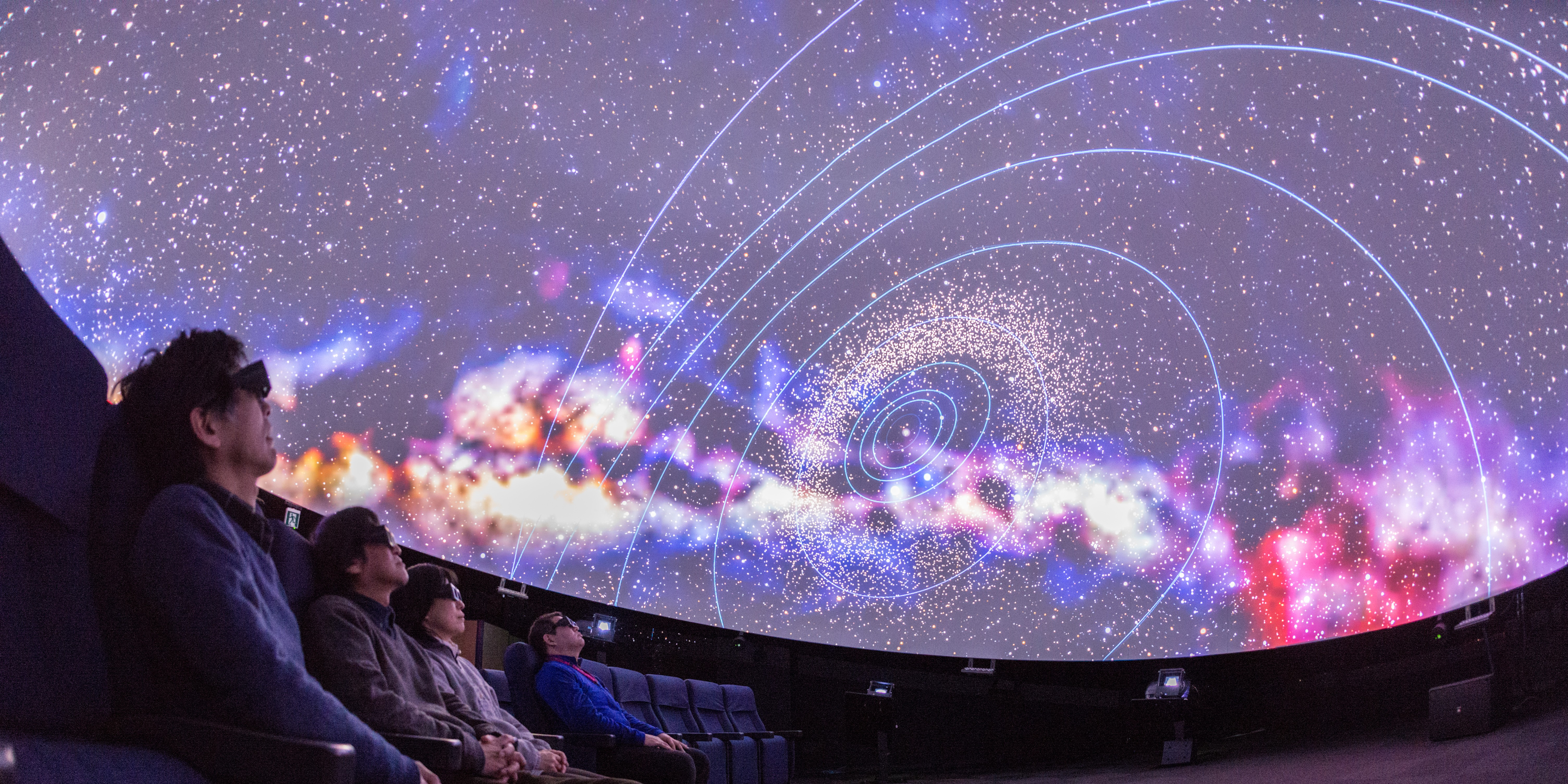 People sitting in planetarium